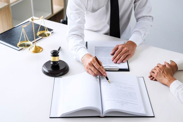 Businessman and lawyer discuss the contract document. Treaty of the law. Sign a contract business.