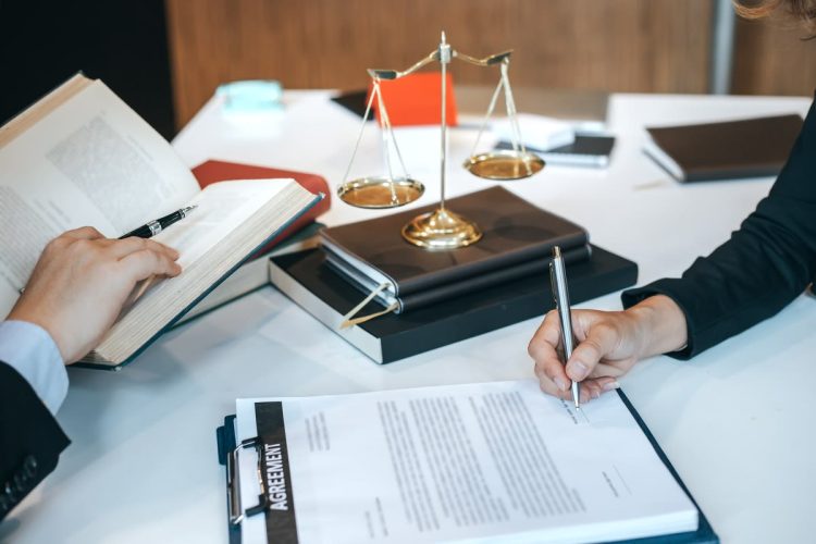Businessman and lawyer discuss the contract document. Treaty of the law. Sign a contract business.